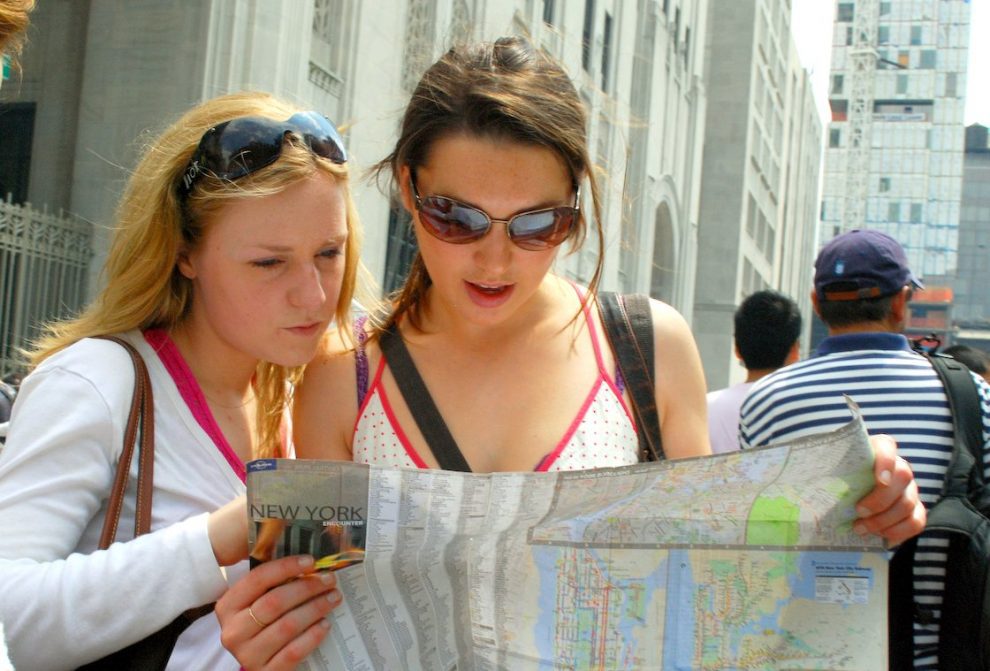 Two Females Reading A Map. Two Females Reading A Map.