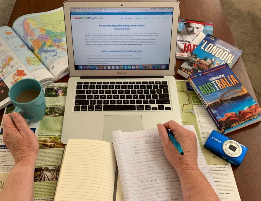 To Be A Travel Writer Writing Blog Posts, Ebooks And Travel Guides You Need A Laptop, Pen and Writing Materials To Make Notes.