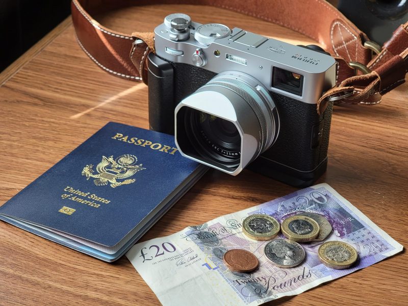 American Passport With A Camera And Money Ready For Travel.
