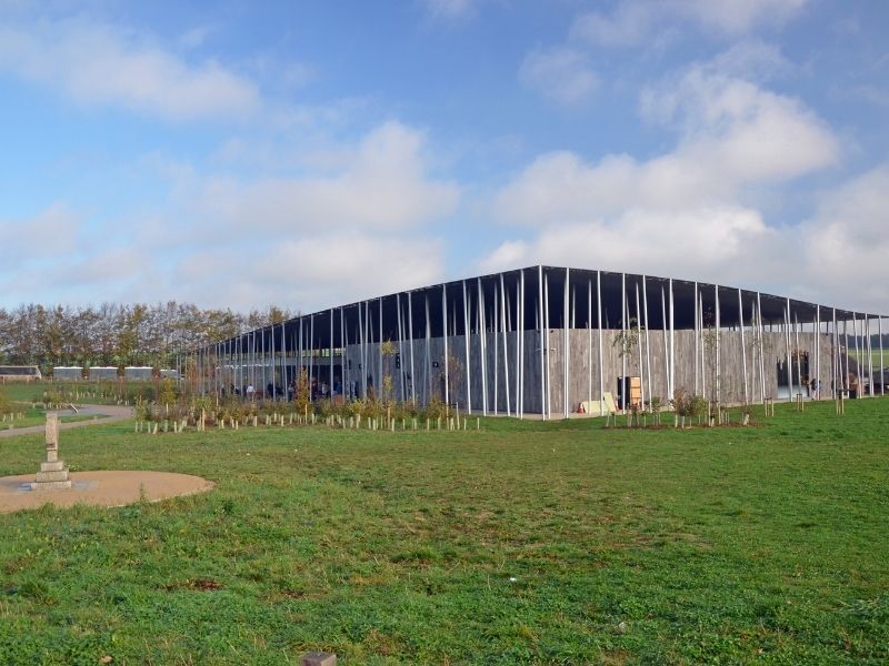 Stonehenge Visitor Centre Is A Large Building In The Middle Of A Field Where You Can Learn About Stonehenge.