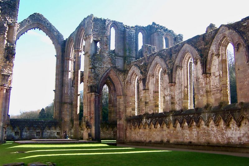 Fountains Abbey In Yorkshire Is An Abbey In Disrepair. Visit To See The Massive Remains Of Windows and Structure. It Must Have Been Magnificent. Visit It On A Day Trip From London.