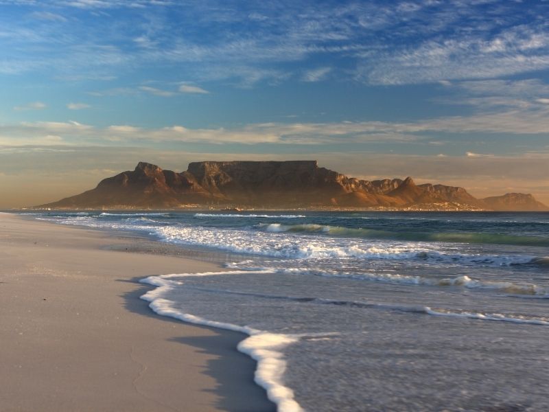 A Beach With Tabletop Mountain, Cape Town, South Africa Overlooking. What A Wonderful Place For A Digital Nomad To Be.