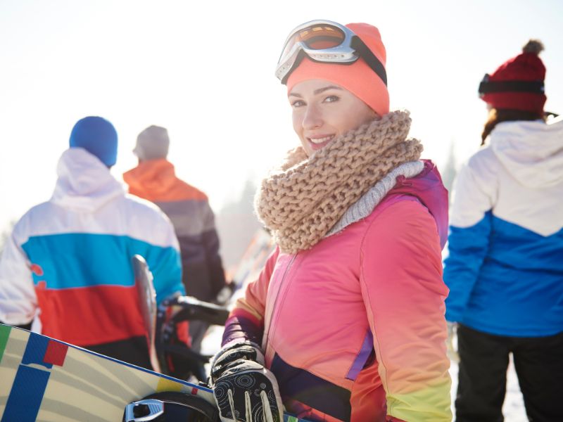Female At The Snow in Ski Clothes.