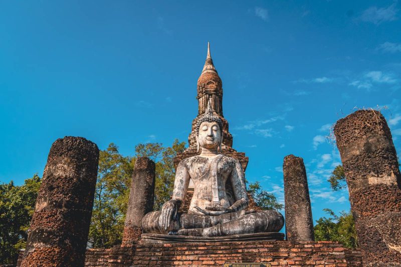 Budha on rocks at Sukhothai Historical Park, Thailand.