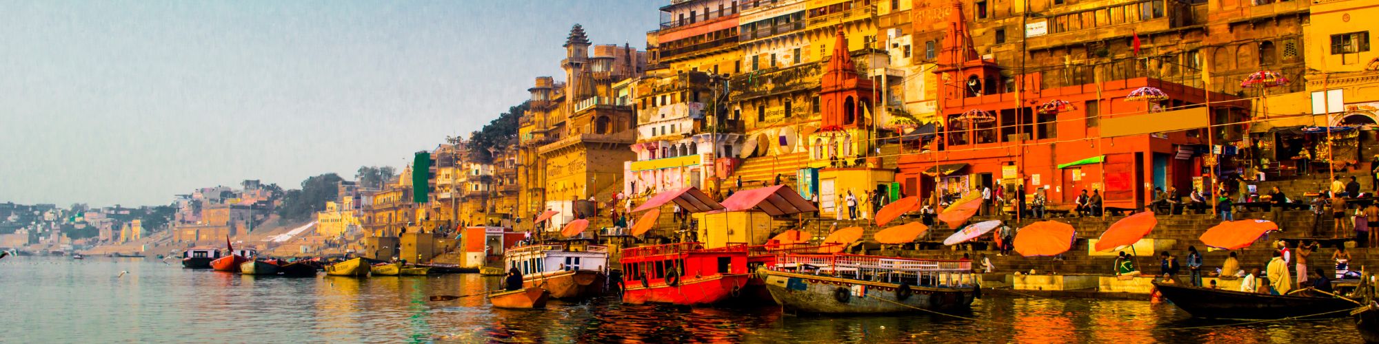 River Ganges with colourful buildings in India.