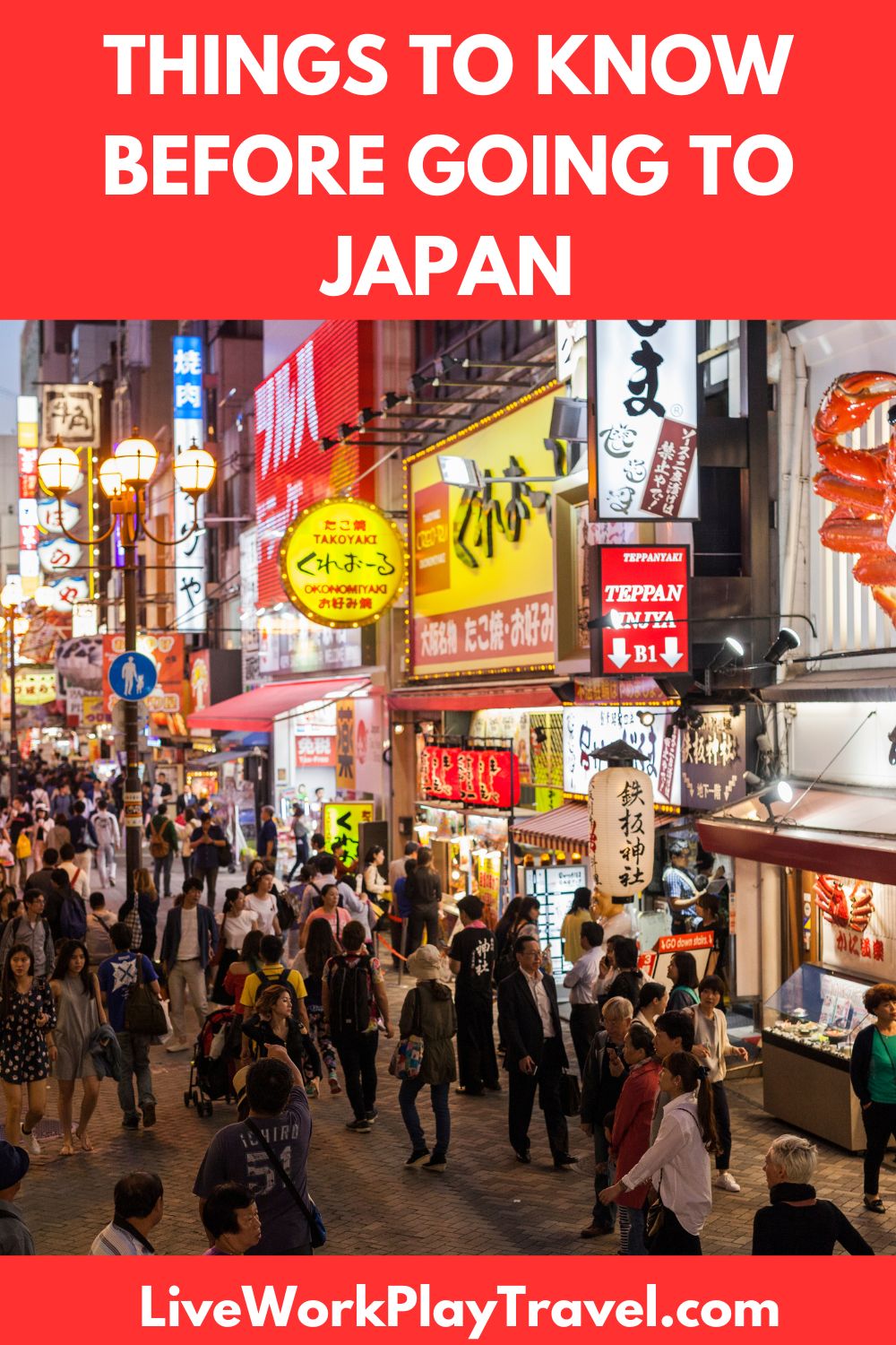 Japanese city at night with neon lights and lots of people