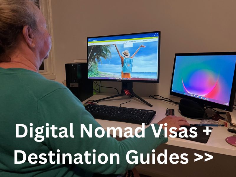 female sitting in front of 2 computer screens on a digital nomad visa